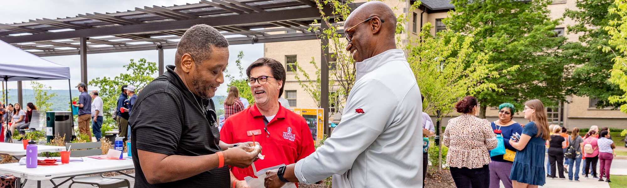 The 2023 Staff Appreciation Picnic with Senate Chair Roy Cordell, center, and Chancellor Charles Robinson, right